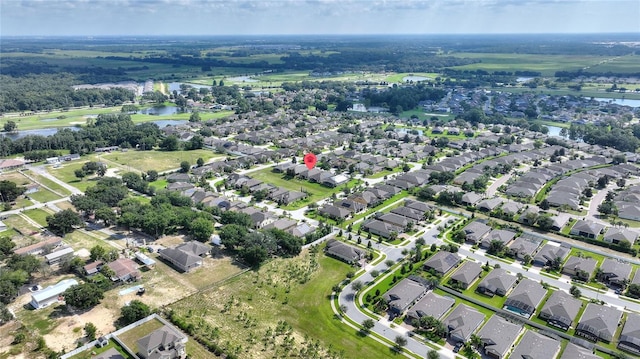 aerial view featuring a water view and a residential view