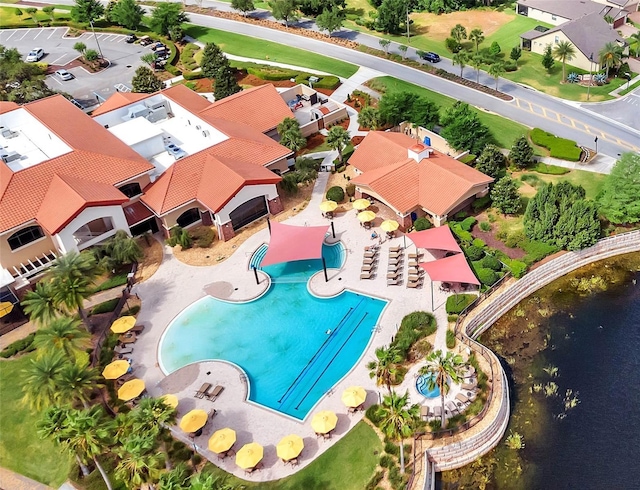 birds eye view of property featuring a water view