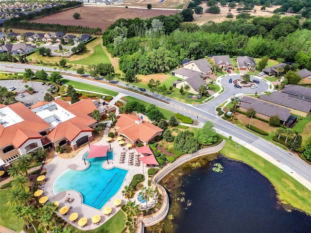 drone / aerial view featuring a water view and a residential view