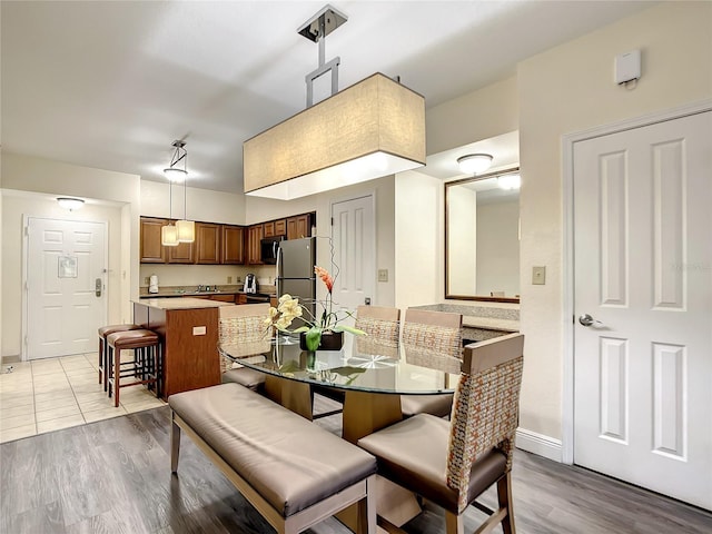 dining space featuring light hardwood / wood-style floors