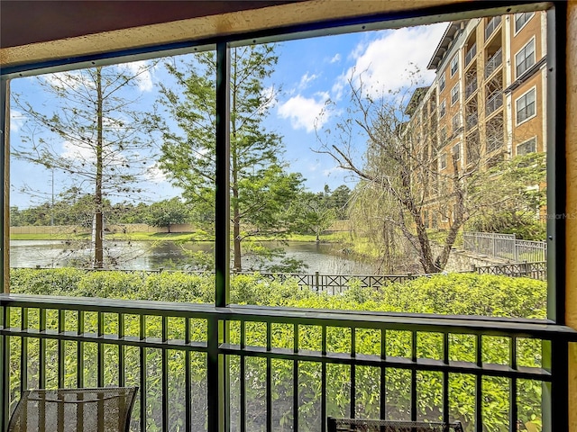 interior space with a water view and plenty of natural light