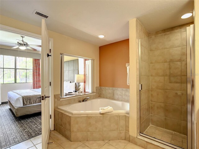 bathroom with plus walk in shower, tile patterned floors, and ceiling fan