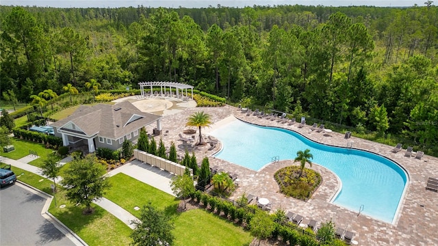 view of pool with a pergola and a patio area