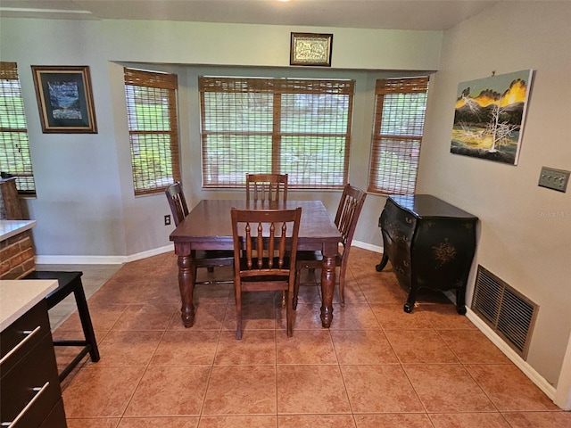 dining area featuring light tile patterned floors