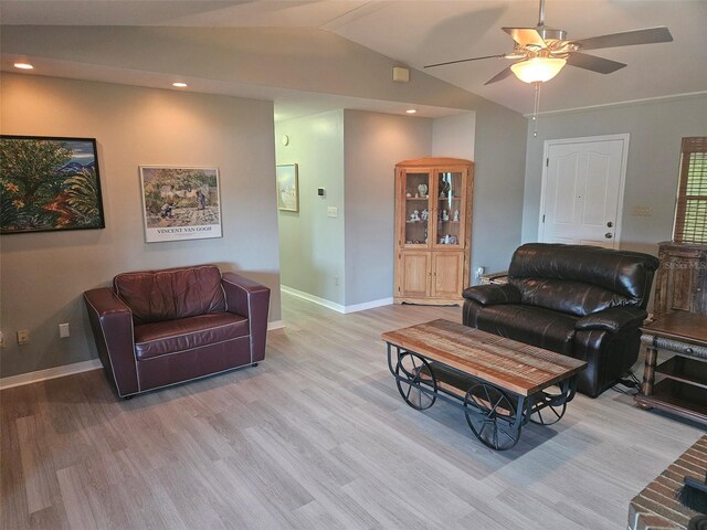 living room featuring light wood-type flooring, ceiling fan, and lofted ceiling