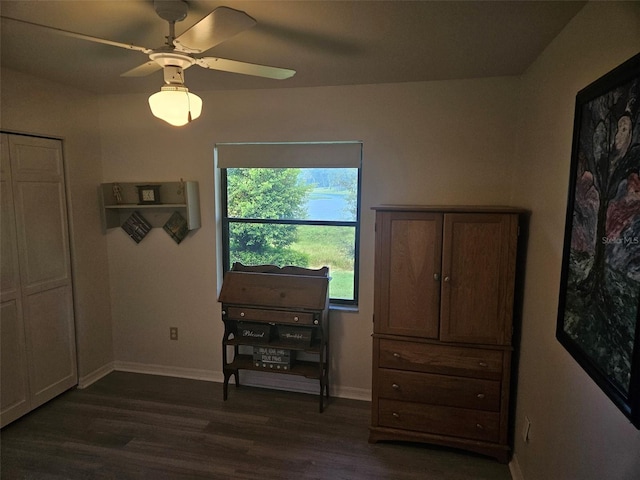 bedroom with ceiling fan and dark wood-type flooring