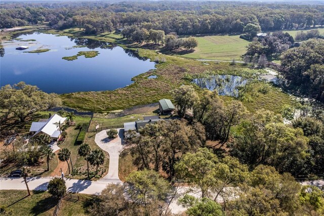 birds eye view of property with a rural view and a water view