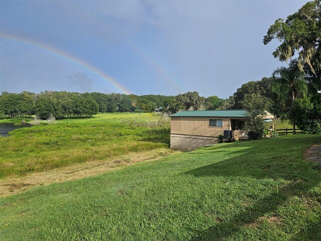 view of yard with a rural view