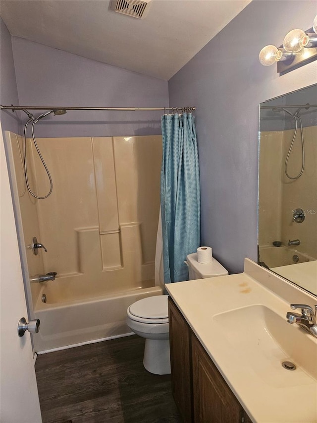 full bathroom with shower / bath combination with curtain, vanity, wood-type flooring, and toilet