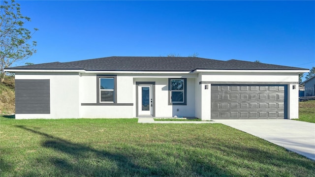 ranch-style house featuring a garage and a front lawn