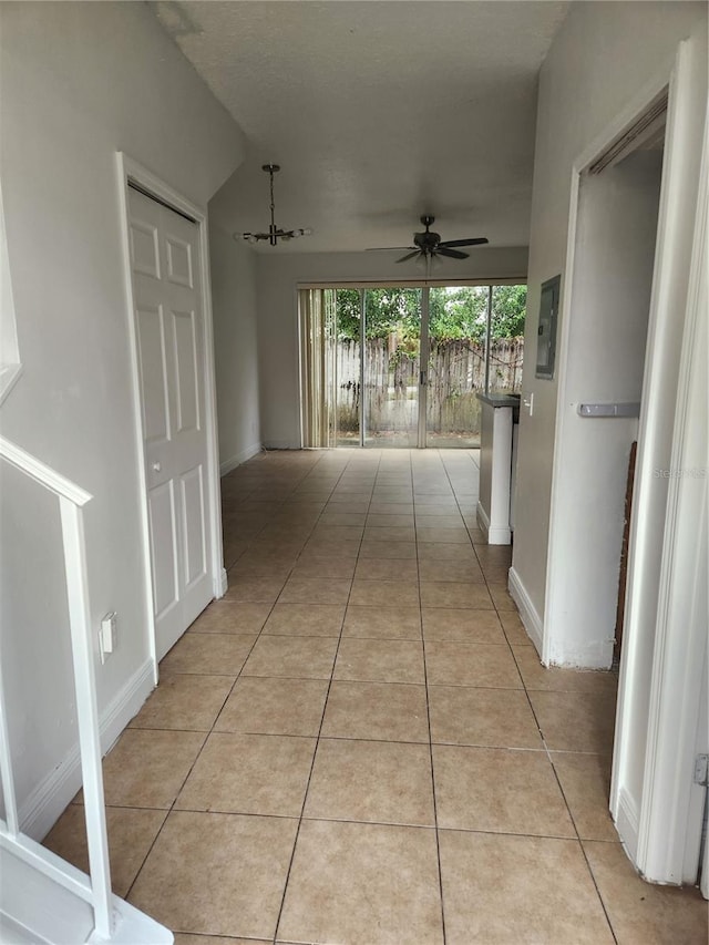 hall featuring light tile patterned floors