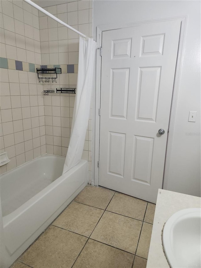 bathroom with shower / bath combo, vanity, and tile patterned flooring