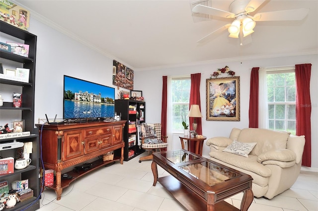 living area featuring plenty of natural light, ornamental molding, and ceiling fan