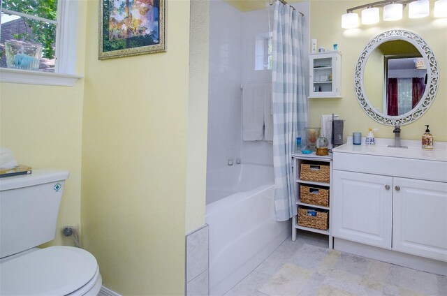 bathroom with shower / bath combination with curtain, vanity, and toilet