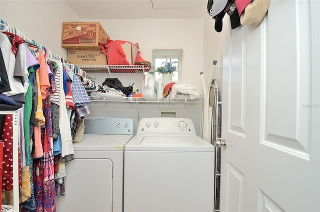 clothes washing area featuring laundry area and washer and dryer