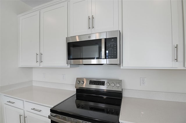 kitchen featuring white cabinets and stainless steel appliances