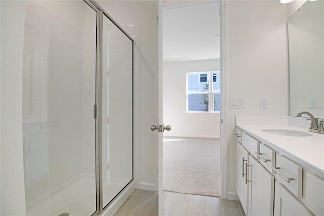 bathroom with vanity and walk in shower