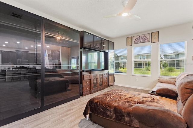 bedroom featuring hardwood / wood-style floors and ceiling fan