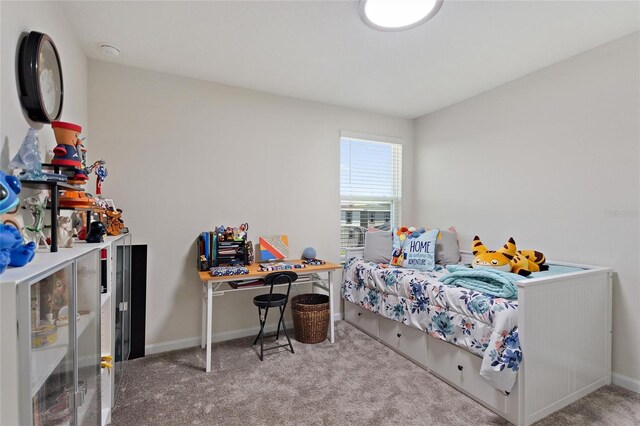 bedroom with light colored carpet