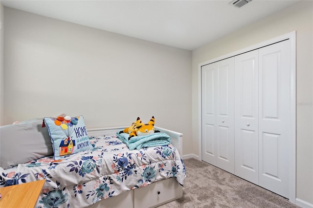 carpeted bedroom featuring a closet