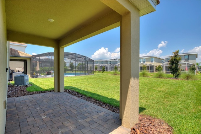 view of patio with cooling unit and a lanai