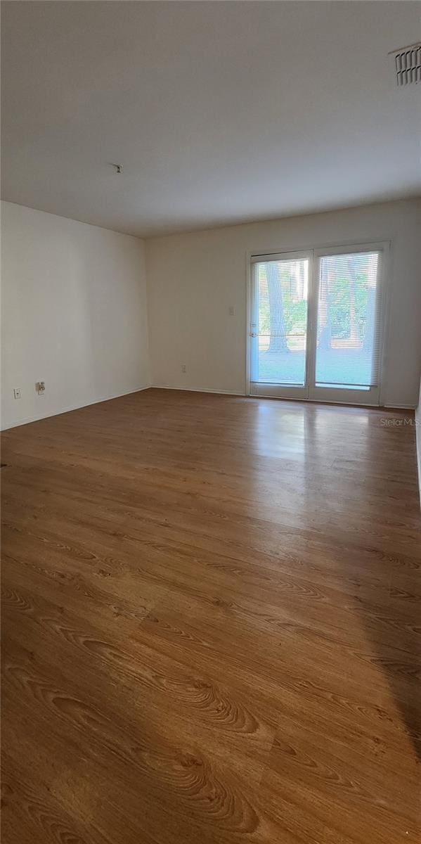 spare room featuring hardwood / wood-style flooring