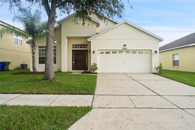 view of front facade featuring a garage, central AC, and a front yard