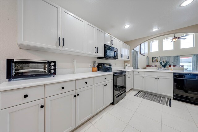 kitchen with ceiling fan, light tile patterned flooring, sink, white cabinetry, and black appliances