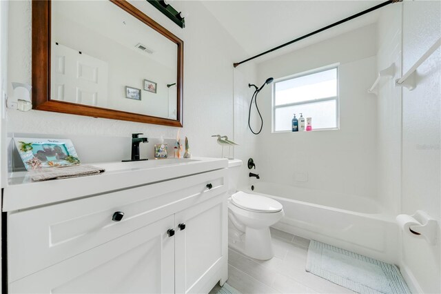 full bathroom featuring shower / bathtub combination, vanity, tile patterned floors, and toilet