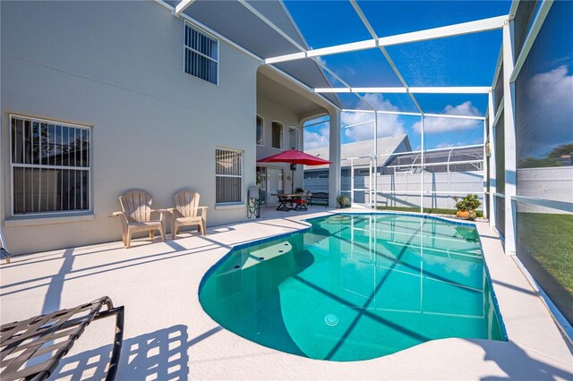 view of pool featuring a patio and a lanai