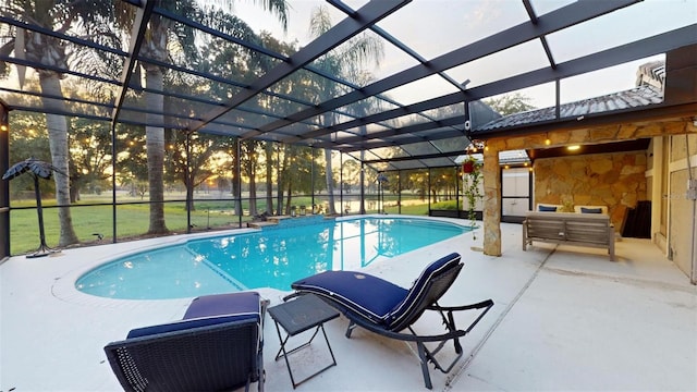 pool with a lanai and a patio area