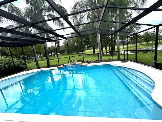 outdoor pool featuring a yard, a patio, and a lanai