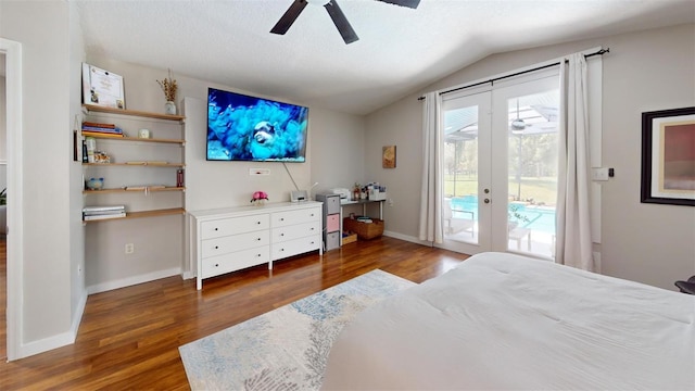 bedroom with baseboards, wood finished floors, access to outside, vaulted ceiling, and french doors