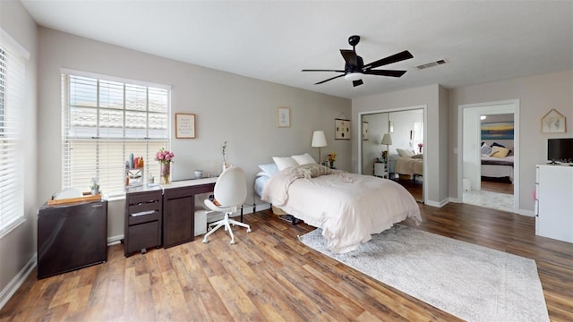 bedroom with a closet, ceiling fan, and light hardwood / wood-style flooring