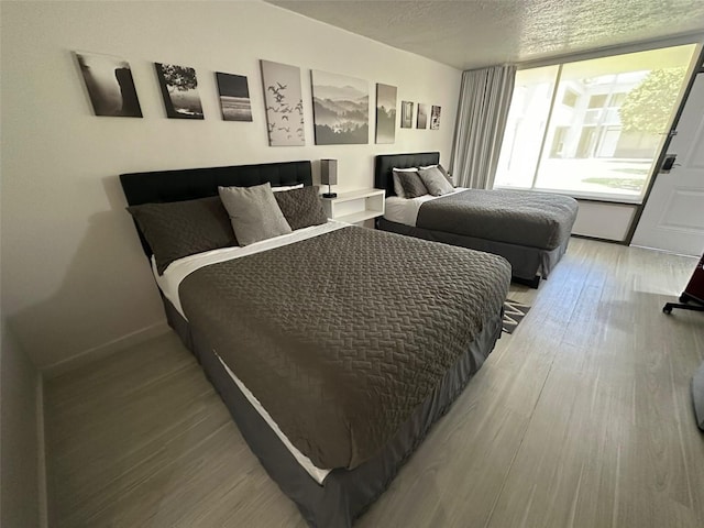 bedroom with light hardwood / wood-style flooring