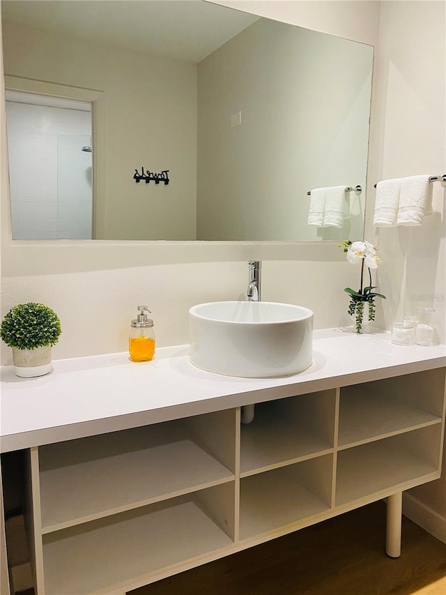 bathroom featuring vanity and wood finished floors