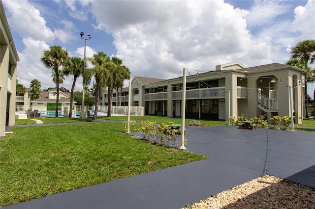 view of property with fence