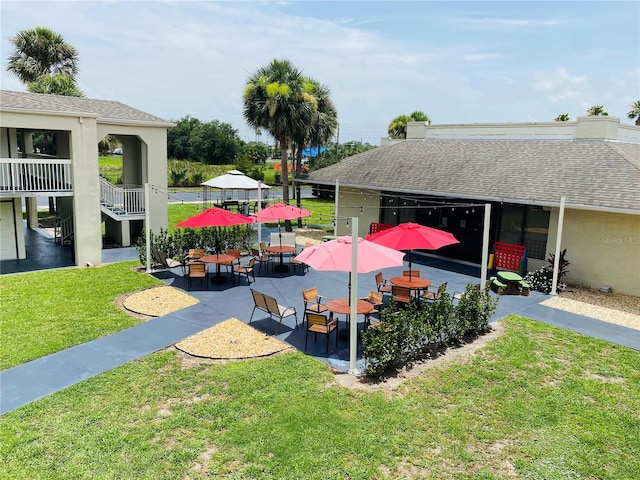 exterior space featuring a yard and a patio area