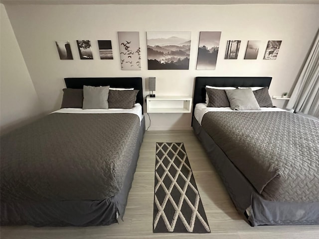 bedroom with light wood-type flooring