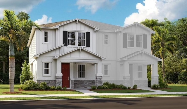 view of front of property with a porch and a front yard