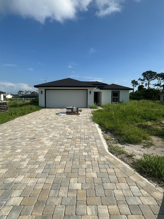 single story home featuring a garage