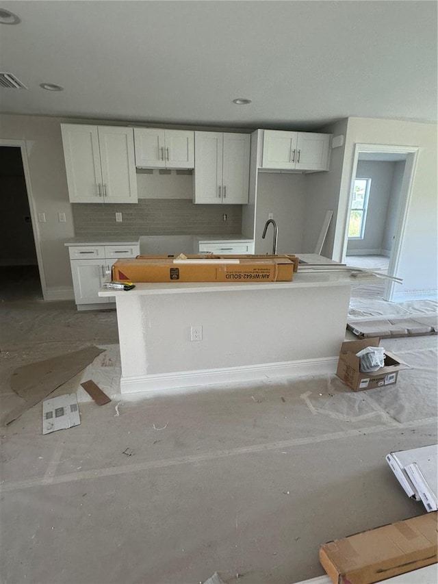 kitchen featuring white cabinetry