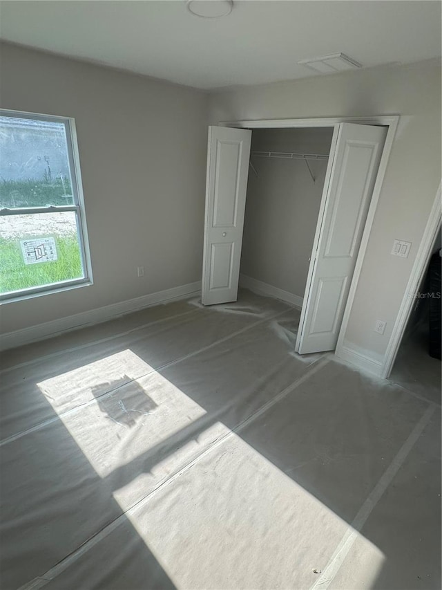 unfurnished bedroom featuring a closet