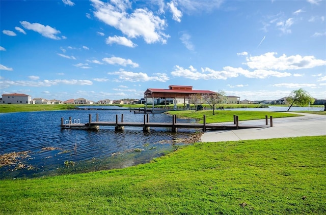 dock area featuring a water view and a yard