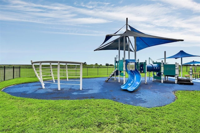 view of playground featuring a lawn