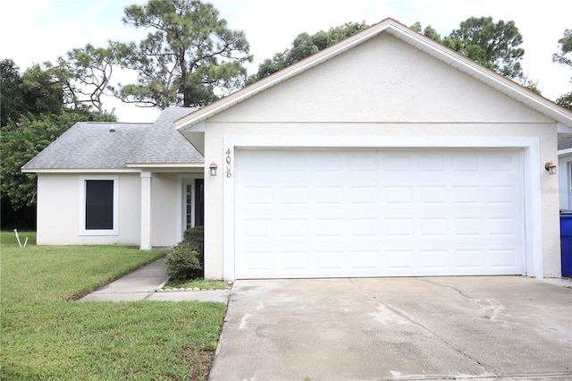 ranch-style house with a garage and a front lawn