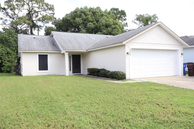 ranch-style house featuring a garage and a front yard