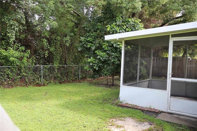 view of yard with a sunroom