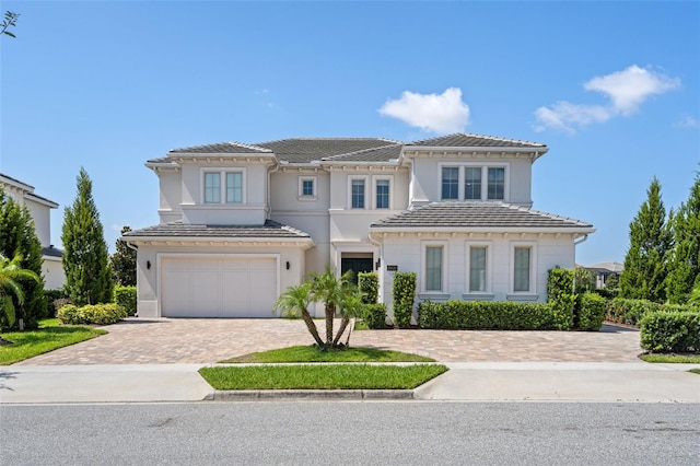 mediterranean / spanish house with a garage