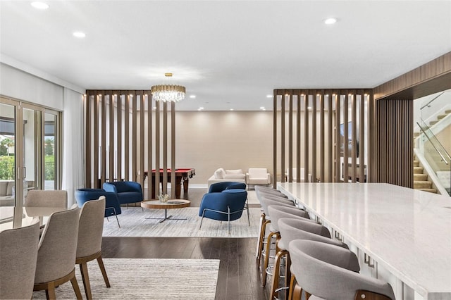 interior space featuring dark wood-type flooring and a chandelier